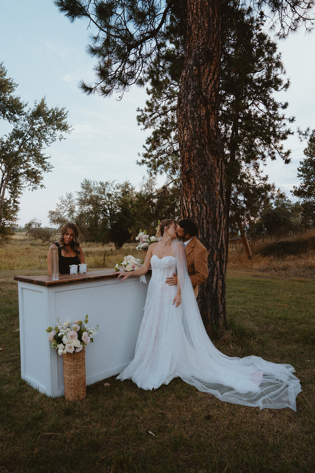 Bar service under the pines as the couple steals a moment